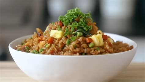 Place the toasted spices in a mortar and pestle and crush into a coarse powder. . Fried rice joshua weissman